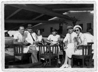 View of Oskar Speck and friends seated in a restaurant 