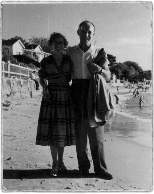 View of Oskar Speck and friend standing on a beach 