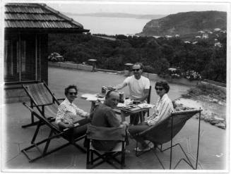 View of Oskar Speck and friends dining at his house at Killcare