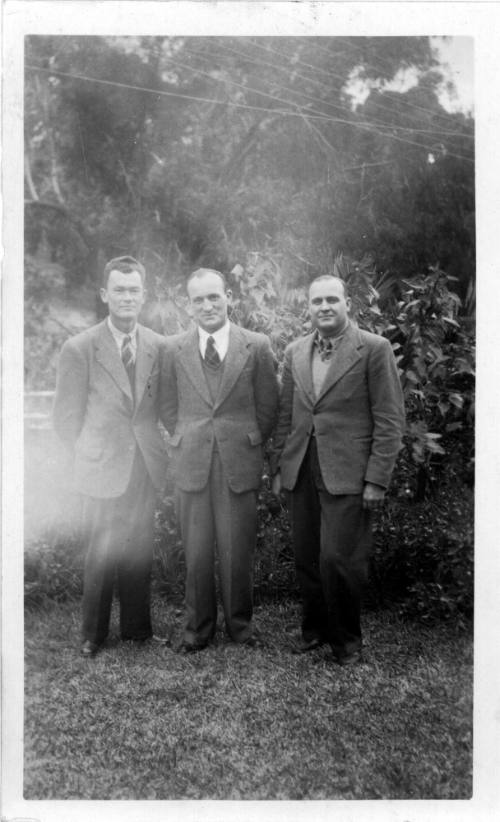 View of Oskar Speck and friends standing in a garden 