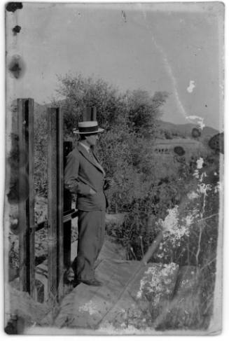 View of a man leaning against steel beams 