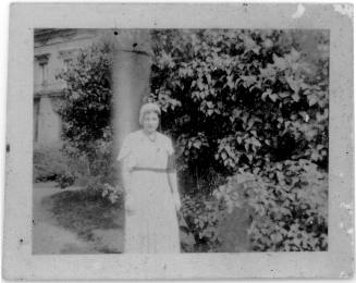 View of a woman wearing white in a garden