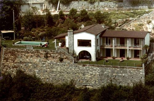 View of a hillside house with a pool 