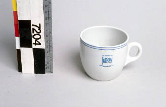 White mug with 'BHP' initials from M.V. IRON CARPENTARIA.