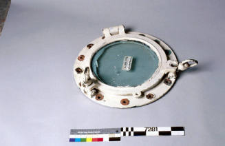 Porthole and glass from wreck ECHENEIS.