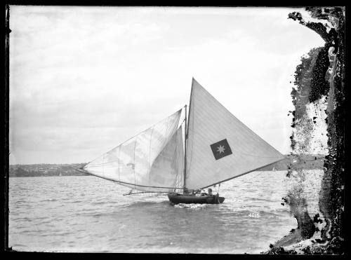 8 - 10-foot skiff under sail on Sydney Harbour