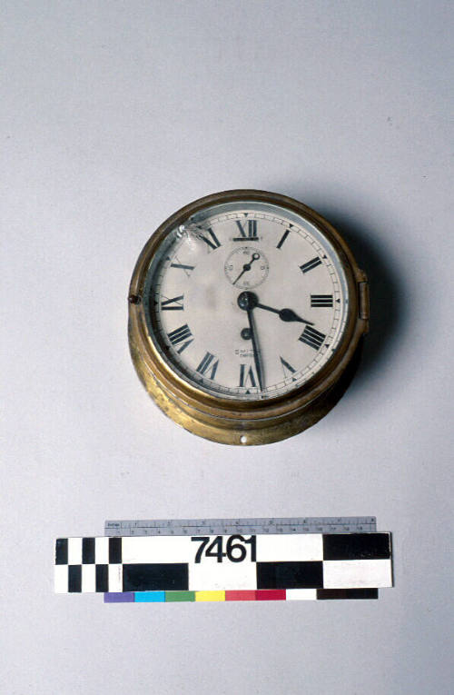 Ship's clock with spare lens from yacht NYMPHEA