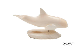 Dolphin figurine scrimshandered from whale tooth