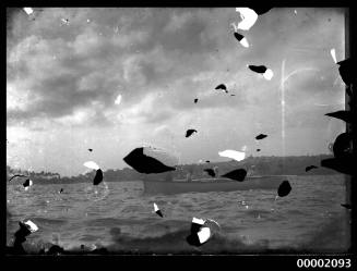 Damaged imaged of a naval rowing boat on Sydney Harbour