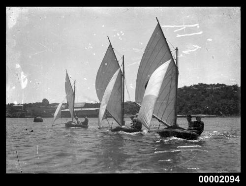 Three 6-footers sailing on Sydney Harbour