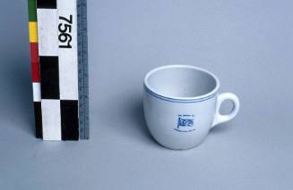 Cup from MV IRON CARPENTARIA, with house flag for Broken Hill Proprietary Company Limited (BHP).