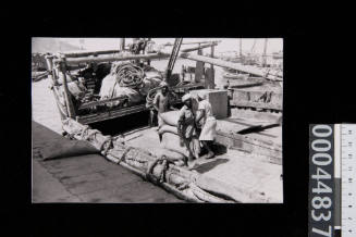 Crew on a large dhow at Ma'alla in Aden, Yemen