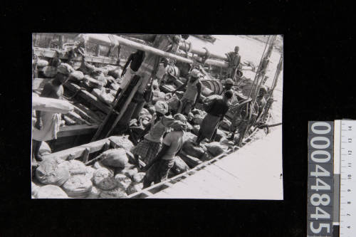 Crew on the deck of a large dhow at Ma'alla in Aden, Yemen