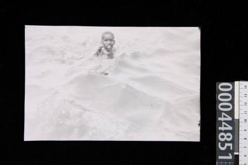 A child swimming in Aden Harbour, Yemen