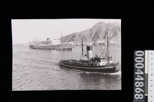 WARWICK CASTLE and tugboat CHAMPION in Aden Harbour, Yemen