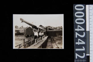 YWCA Women's rowing team carry boat overhead from Gardner's Boat Shed