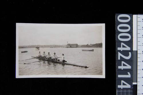 YWCA Women's rowing team. Female coxswain.