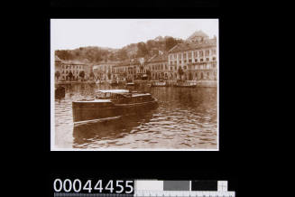 Photograph of a motor launch built by Lars Halvorsen at the water front at Arendal in Southern Norway.