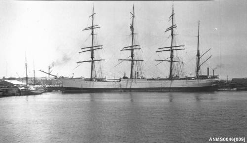 Four masted barque alongside wharf