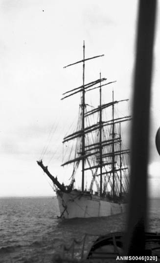 Four masted barque under tow