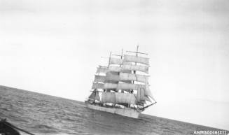 Four masted barque setting or reducing sail