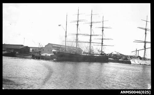 Four masted barque alongside wharf