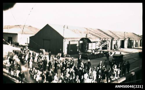 Group of people with streamers farewelling a ship