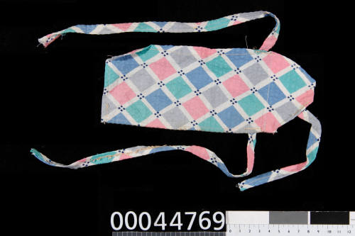 Doll's apron prop used by Lois Carrington