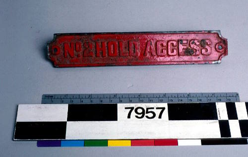 Red painted sign from ATLANTIC COUNTESS with inscription reading 'No 2 HOLD ACCESS'.




