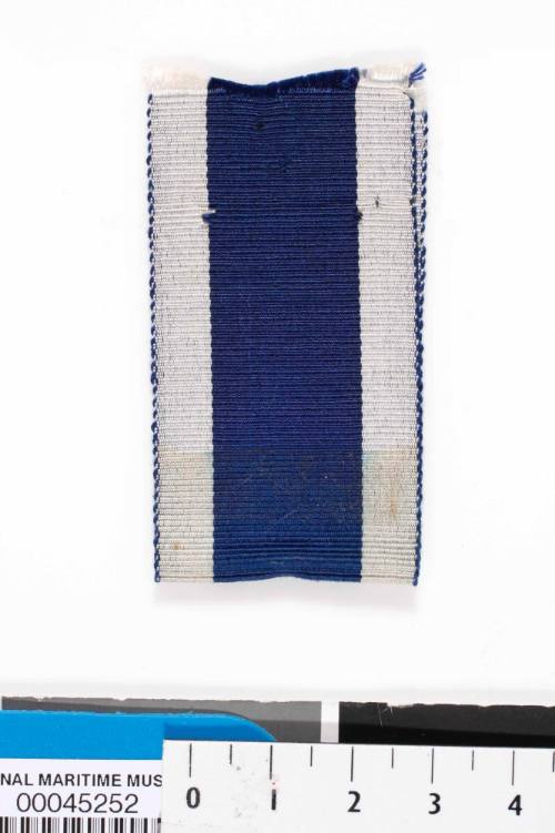 Long Service and Good Conduct ribbon from medal 00009320 issued to John Lang Leading Stoker 1st Class