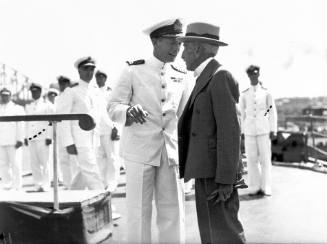 HMAS SYDNEY's Captain John Collins talking to Billy Hughes, 10 February 1941