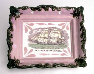 The STAR OF TASMANIA : pink lustreware plaque