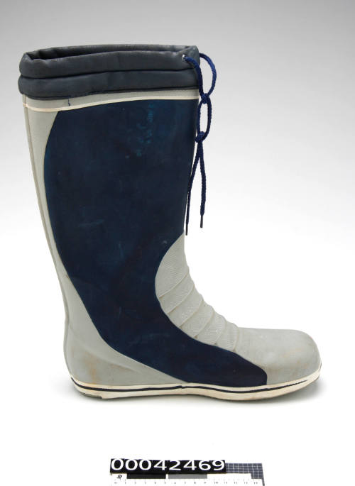 Left Gill brand wet weather boot worn on board BERRIMILLA II