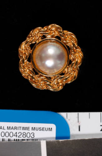 Gold metal and cultured half pearl (or mabe pearl) earring