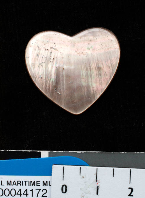 Pearl shell, trimmed and polished, and cut in the shape of a heart