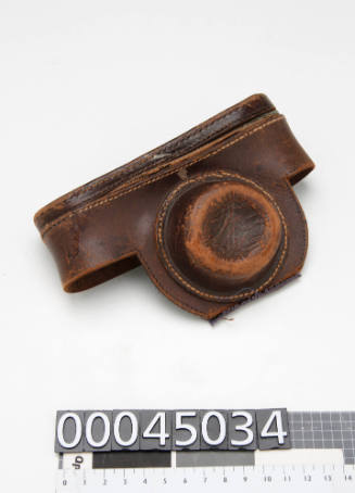 Top half of a broken brown leather camera case (the bottom half is 00045035) for Leica camera (00045033)