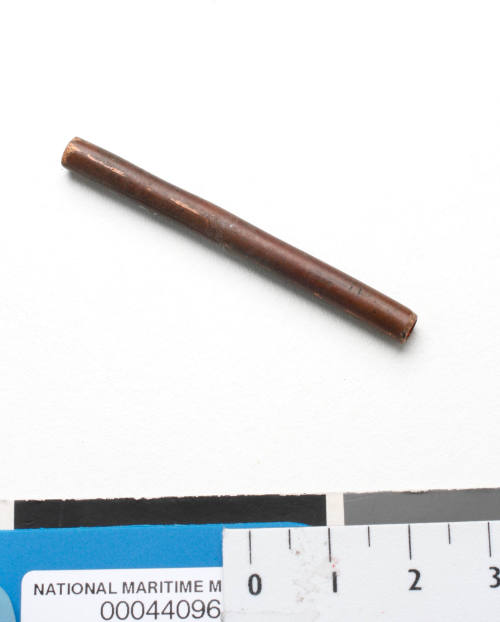 A small, hollow metal rod