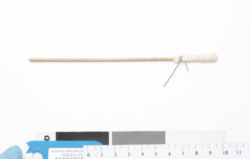 An implement consisting of wood, cloth and wire