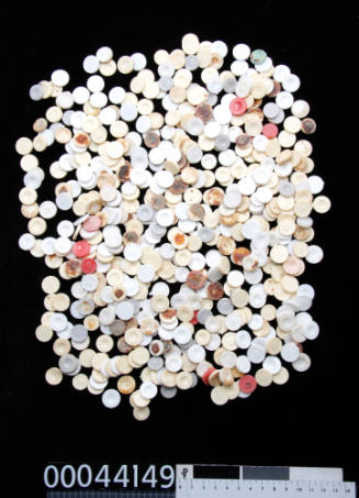 Five hundred and thirty-five plastic disks, used for making pearls