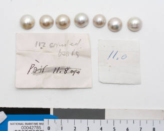 Seven small cultured half pearls (or mabe pearls) with shell bases