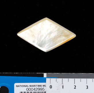 Diamond shaped piece of gold-lip oyster shell