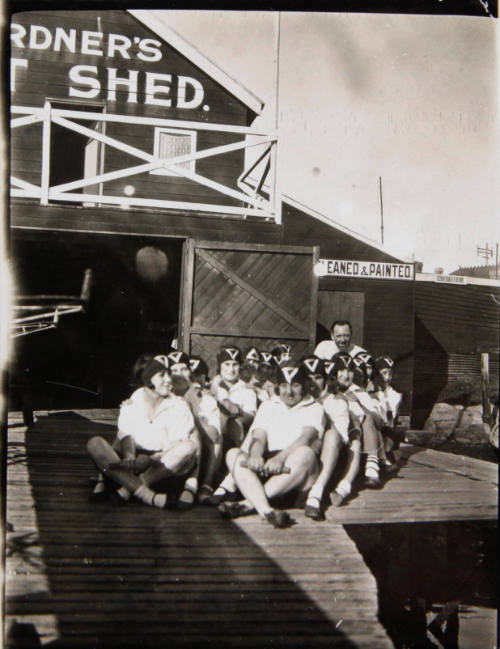 Portrait of YWCA rowers outside Gardner's boatshed, Sydney