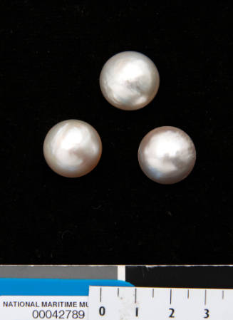 Three half pearls (or mabe pearls) with shell bases