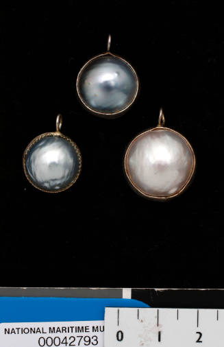 Three cultured half pearl (or mabe pearl) and electroplated silver pendants