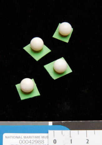 Four shell nuclei on green plastic boards