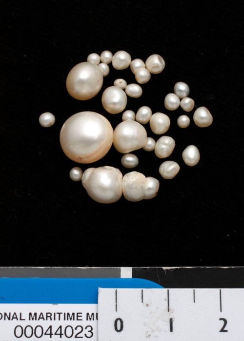 Twenty-nine baroque cultured and possible natural pearls