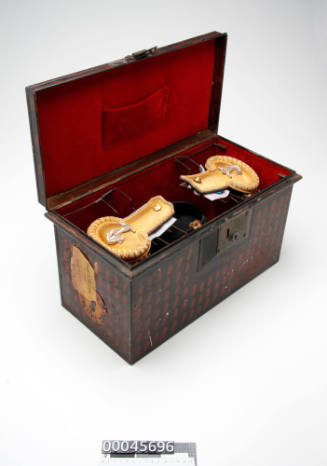 Hat box containing Royal Australian Navy Officer's cocked hat and epaulettes, belonging to Captain L N Dine