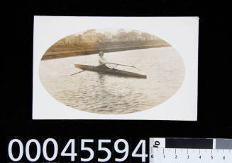 Postcard of single women rowing