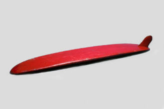 Red fiberglass covered Malibu surfboard