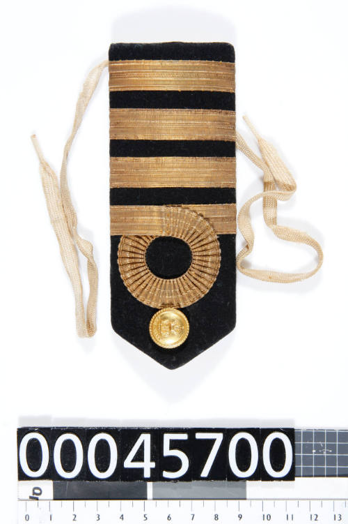 One of a pair of epaulettes from a Royal Australian Navy Captain's uniform, belonging to Captain L N Dine